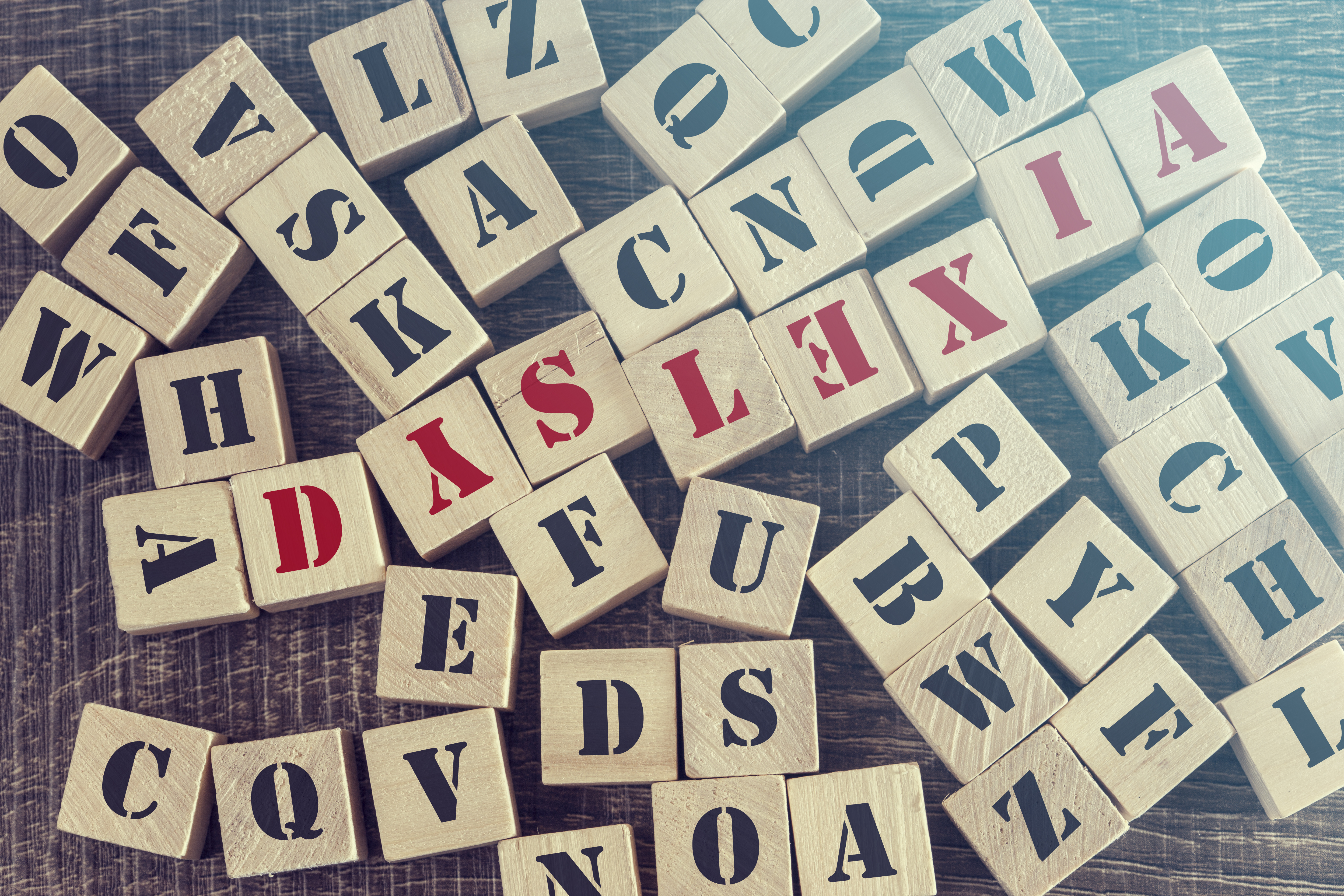 Dyslexia word formed with wooden blocks. Reading difficulties concept